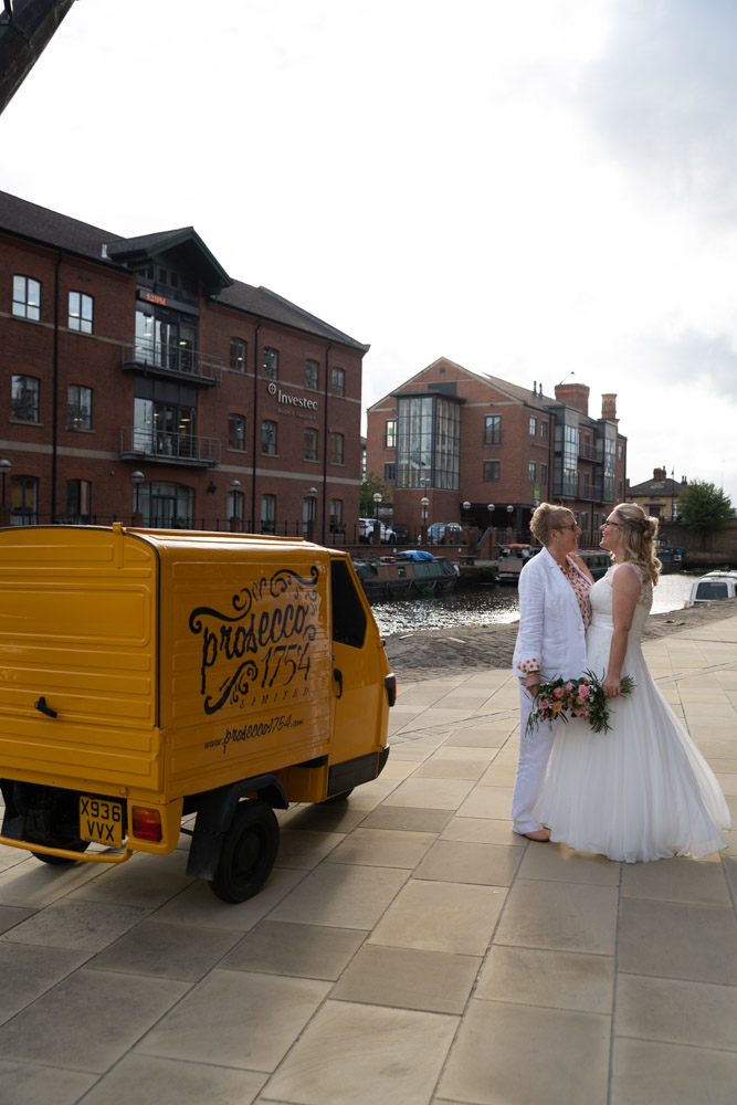 The couple return to the yellow Prosecco van in the evening sun