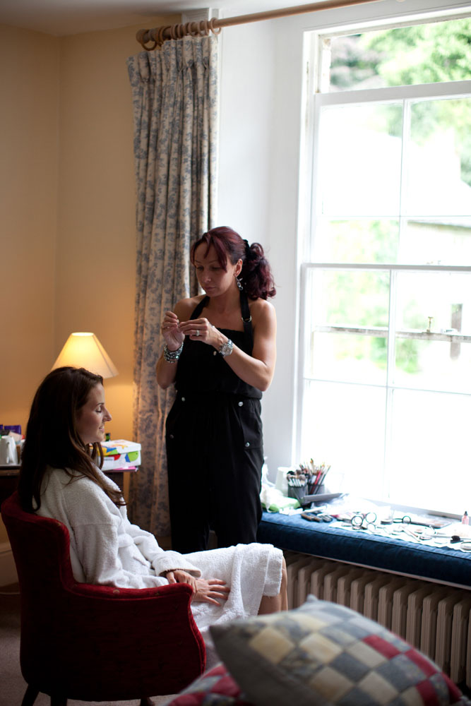 Lowri, the bride, sat for make up by Yorkshire wedding photographer