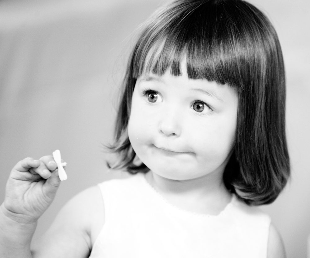 Cute little bridesmaid in black and white - by Leeds, West Yorkshire wedding photographer