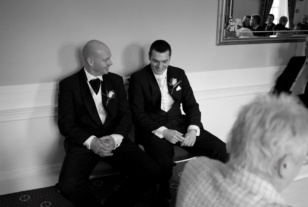 The Groom waits patiently in black and white - Hoyle Court wedding photography