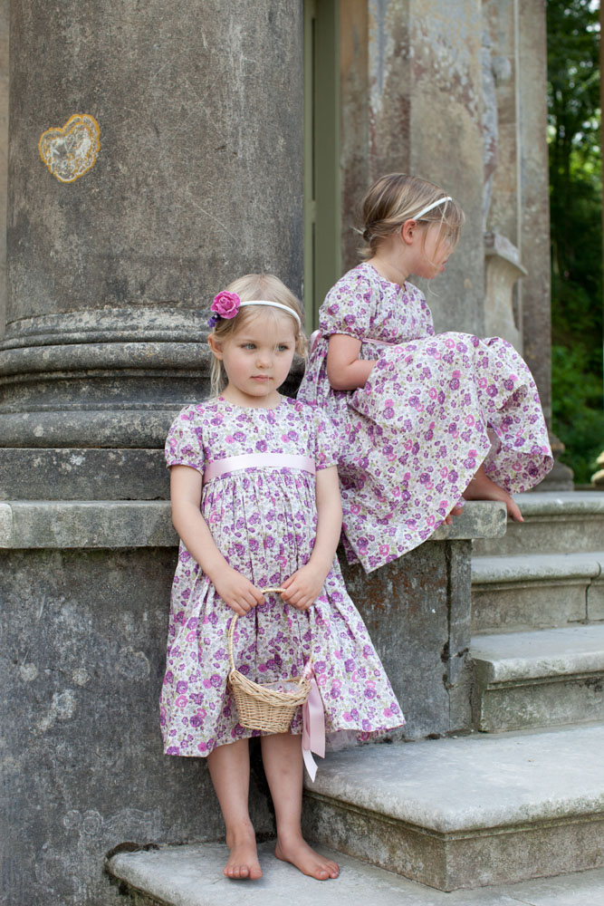 Flower girls, one with a little smile