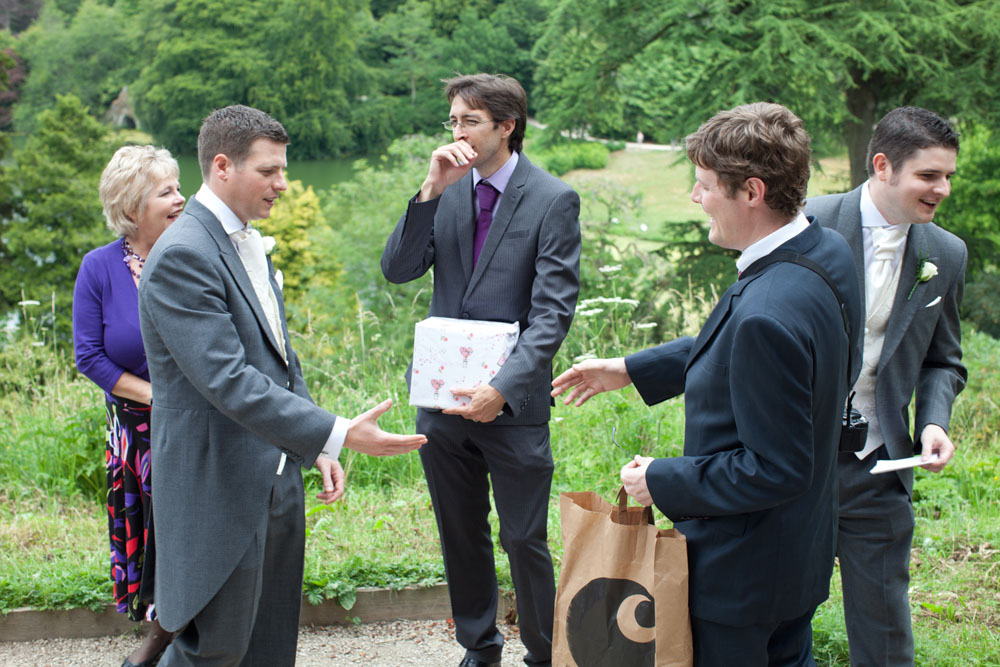 Groom about to shake a friend's hand