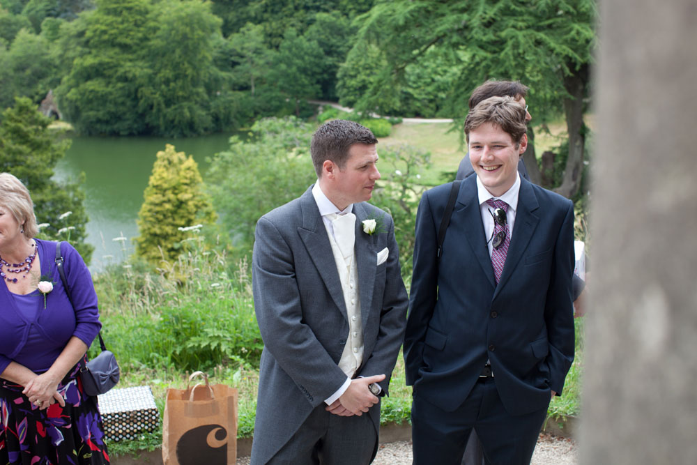 Groom chats with a guest