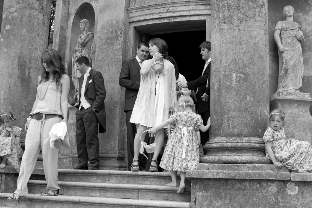 Guests at the door of the Temple in black and white