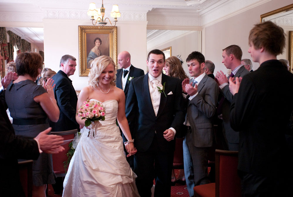 The couple exit the ceremony room - Hoyle Court wedding photography