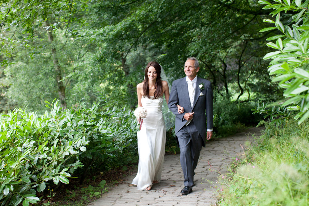 The bride walking up with her father