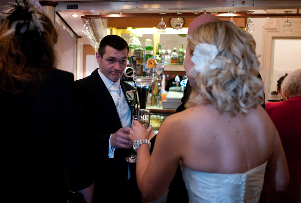 Groom looks at the bride