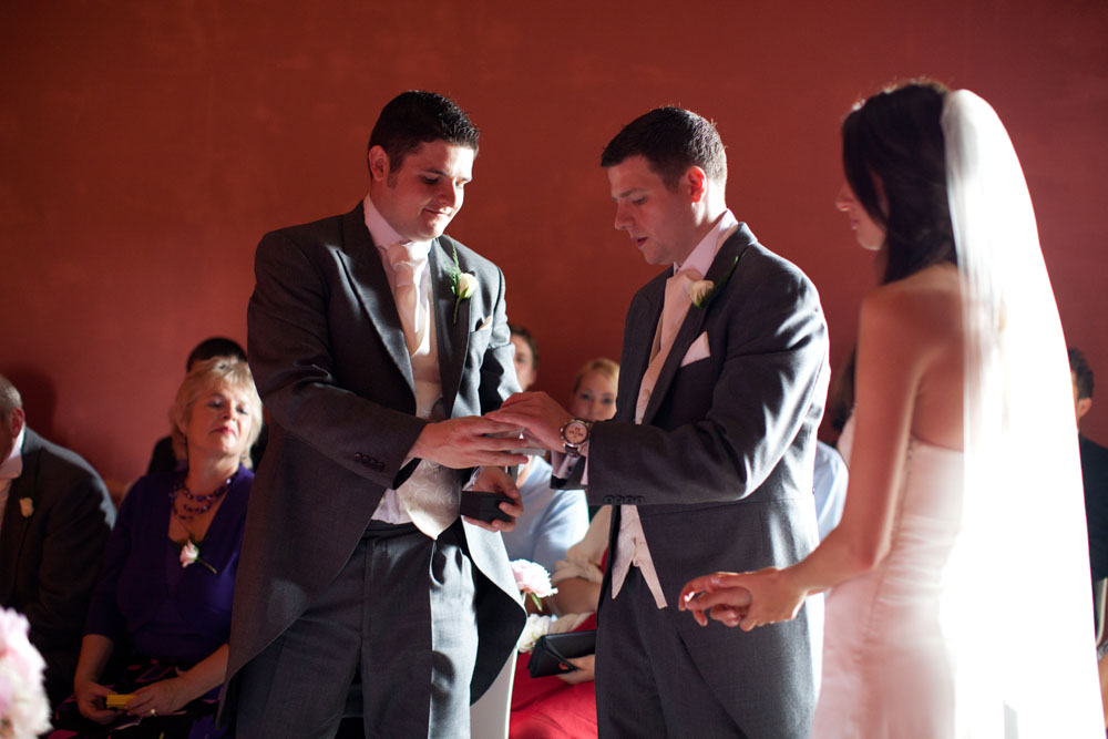 Best man passes the wedding ring to the groom - Yorkshire wedding photography