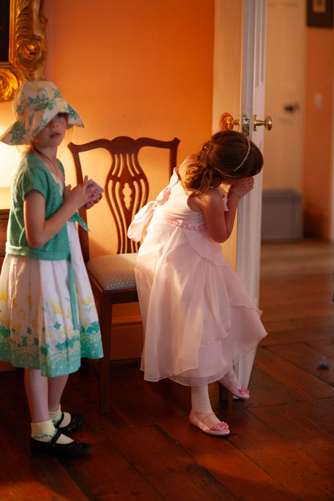 Bridesmaid peeps around the doorway