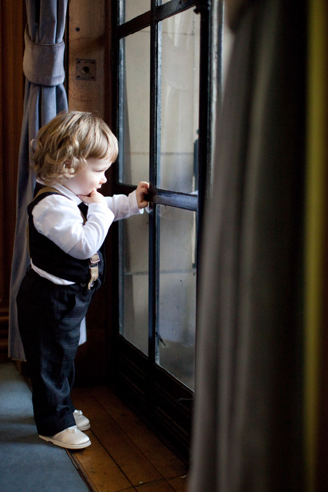 Groom's son looks out the window