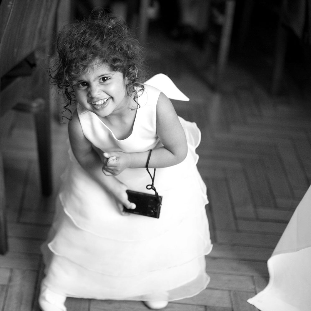 Little cute asian bridesmaid in black and white