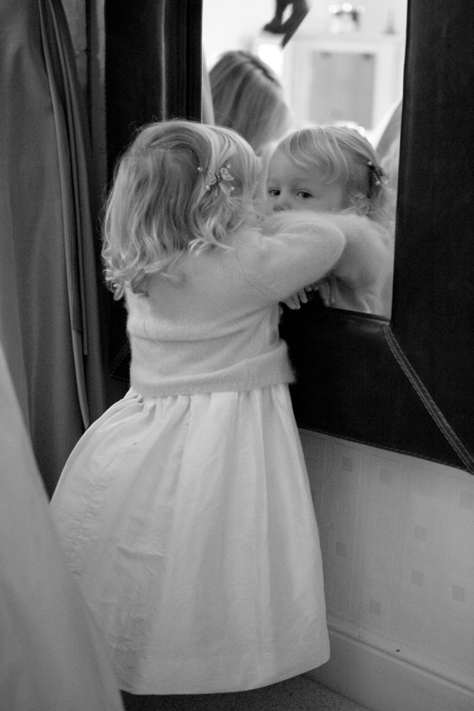 Bridesmaid at the mirror in the hotel