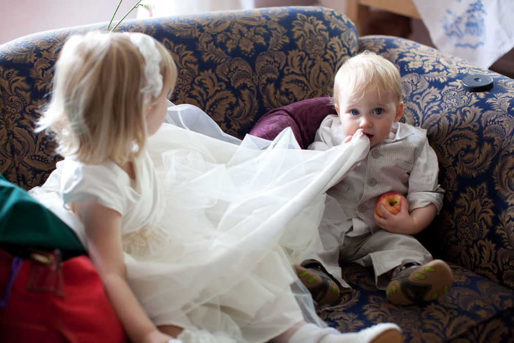 Bridesmaid and little pageboy with an apple