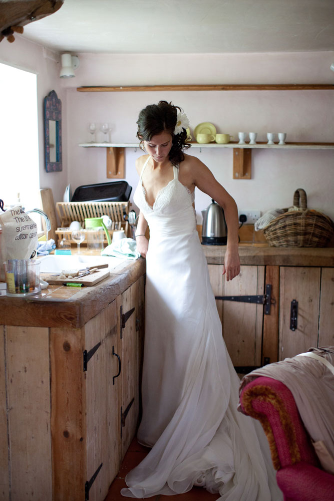 Bride in the kitchen in her dress - emotive Yorkshire and Leeds wedding photography