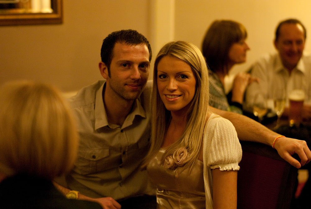 A couple in the ambience of the evening reception by a professional wedding photographer based in Leeds, West Yorkshire