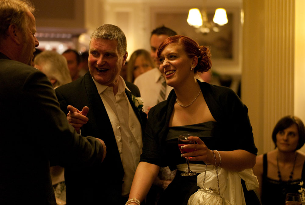 Bridesmaid with the father of the bride by a professional wedding photographer based in Leeds, West Yorkshire