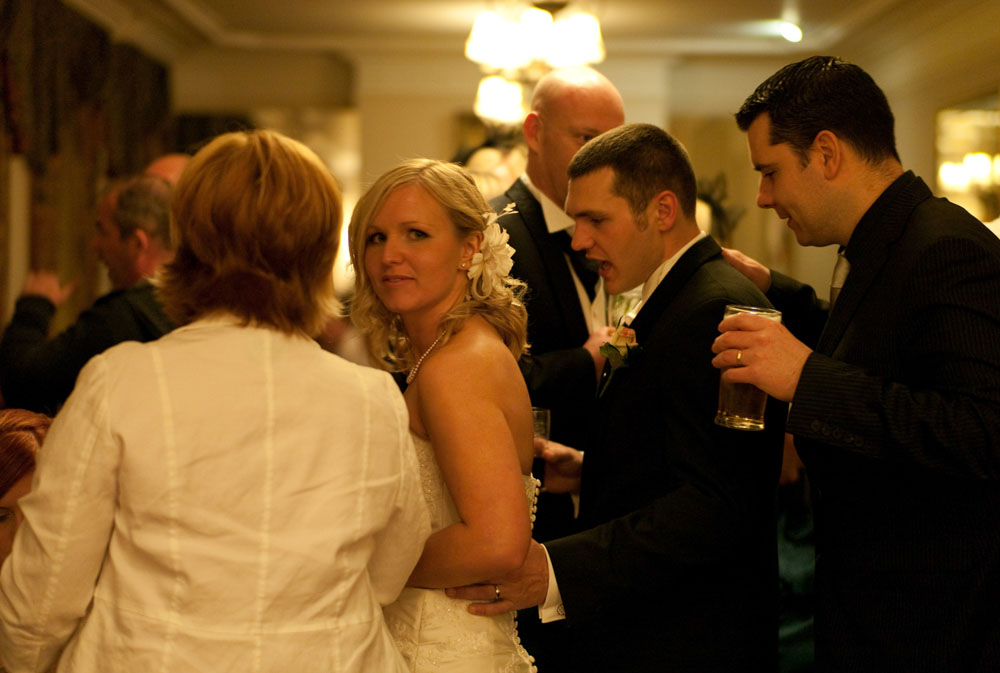 The bride looks at the camera