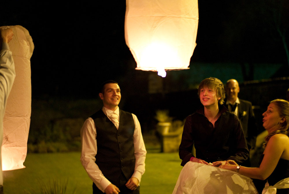 Smiles as the lantern is released - Leeds based wedding photographer