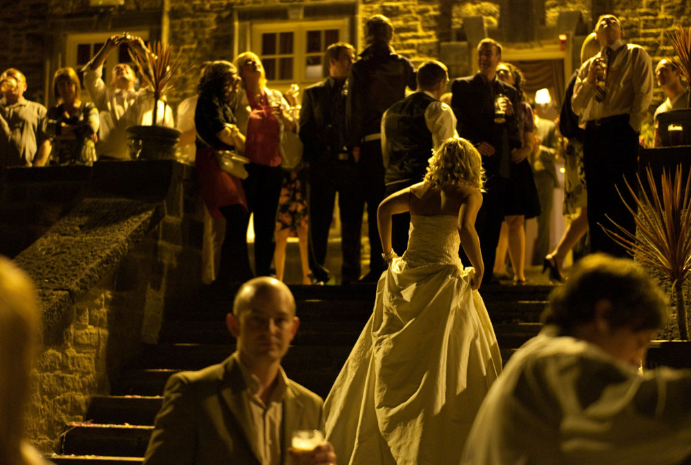 The bride returns to the reception inside