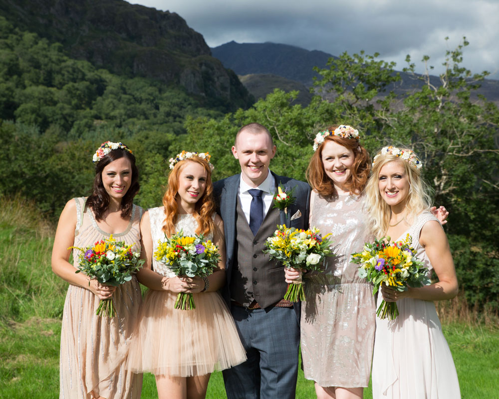 The Groom with the bridesmaids from a Natural wedding photographer based in West Yorkshire