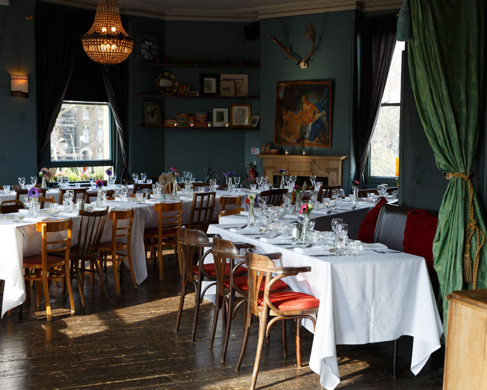 Wedding breakfast artistic tables and chairs - by Leeds wedding photographer