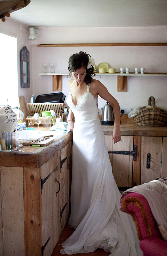 The bride in the kitchen - by Leeds wedding photographer