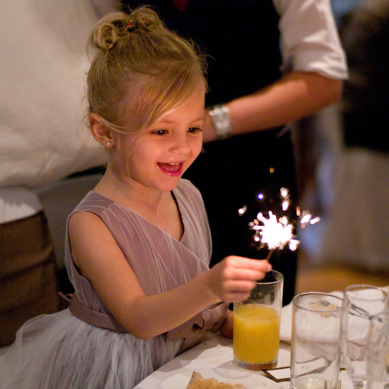 Bridesmaid with a sparkler by Leeds wedding photographer