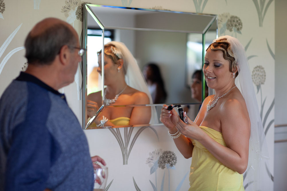 Bride doing her make up - KP Club Pocklington wedding photography