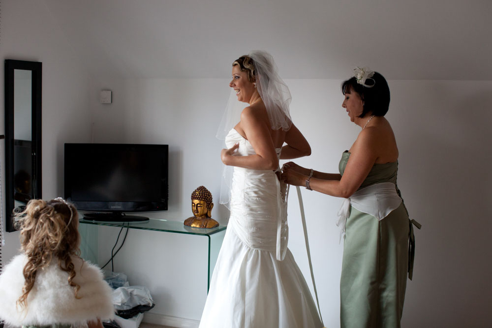 Bride helped into her wedding dress - KP Club Pocklington wedding photography