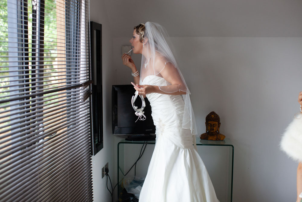 Bride does her lip stick - KP Club Pocklington wedding photography