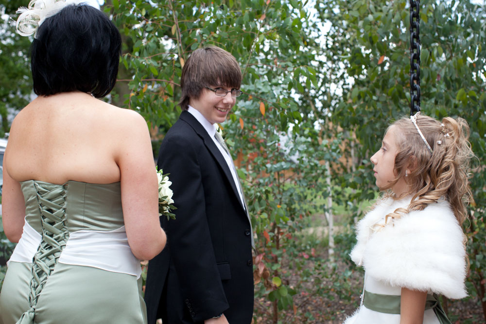 Bride's brother looks into the camera