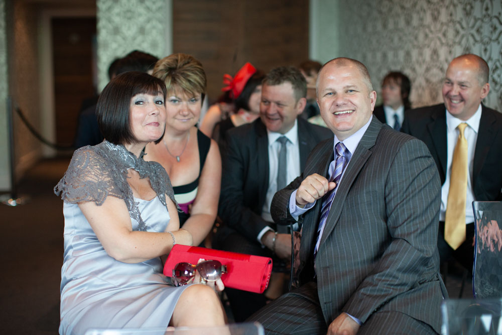 Wedding guests smile for the camera