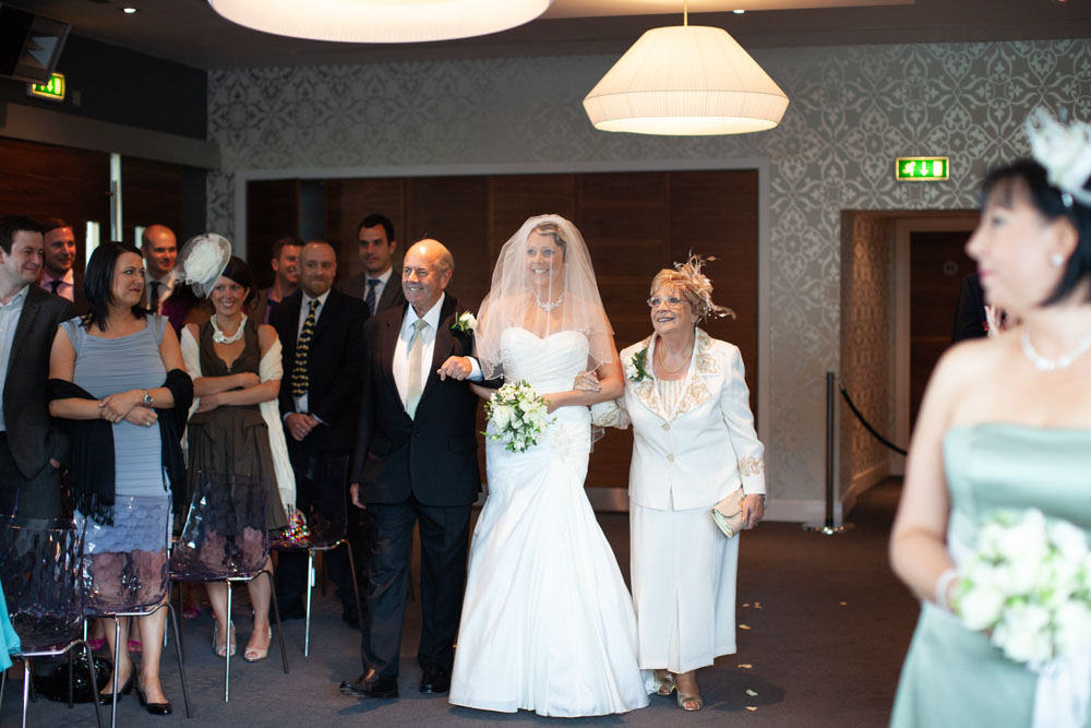 Bride walks in with her parents - KP Club Pocklington wedding photography