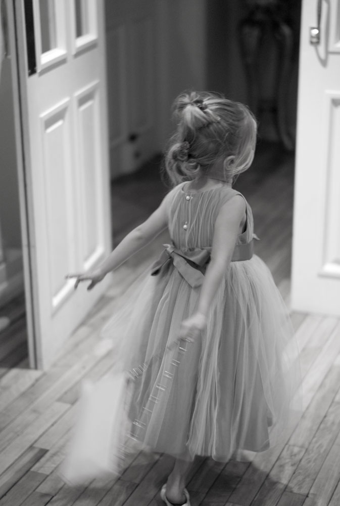 Bridesmaid flowing through a door