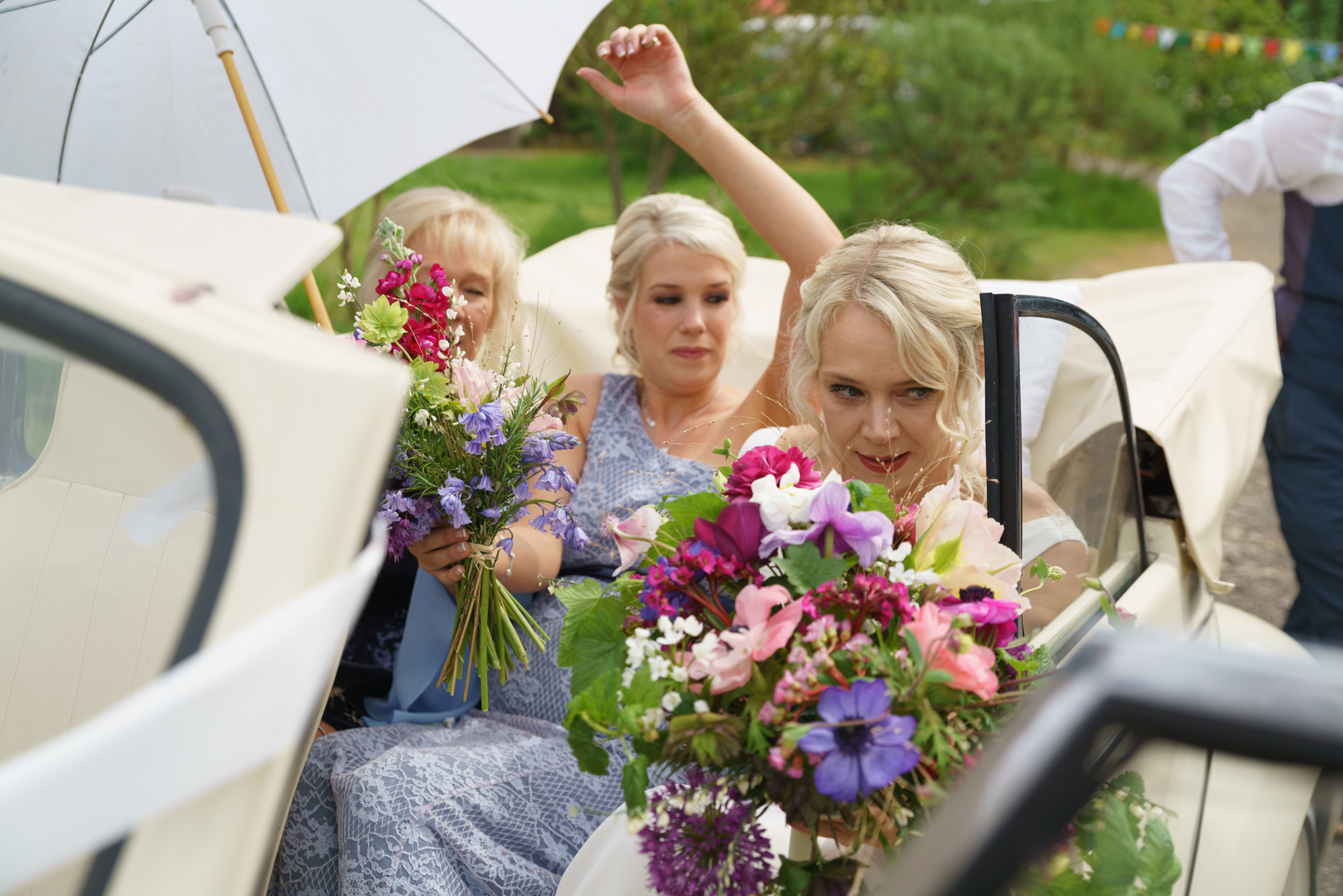 Bride arrives in an open top beetle - Wedding Ceremony photography Leeds and Yorkshire