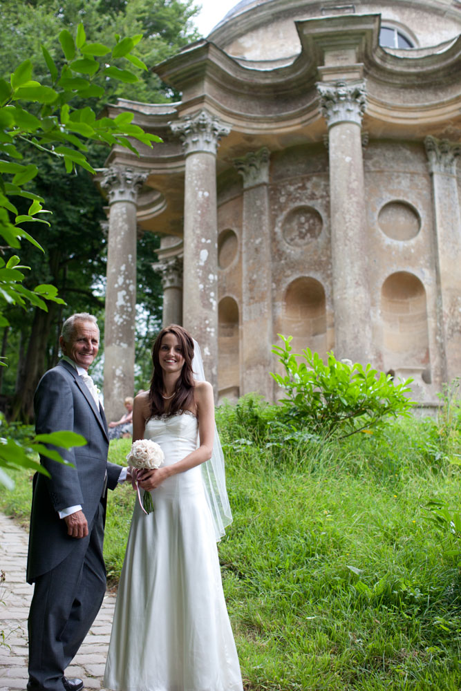 Bride and father turn for a photo