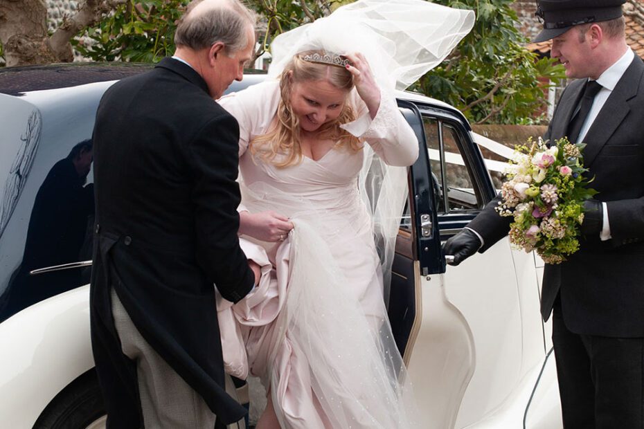 The bride blown in the wind by Leeds wedding photographer