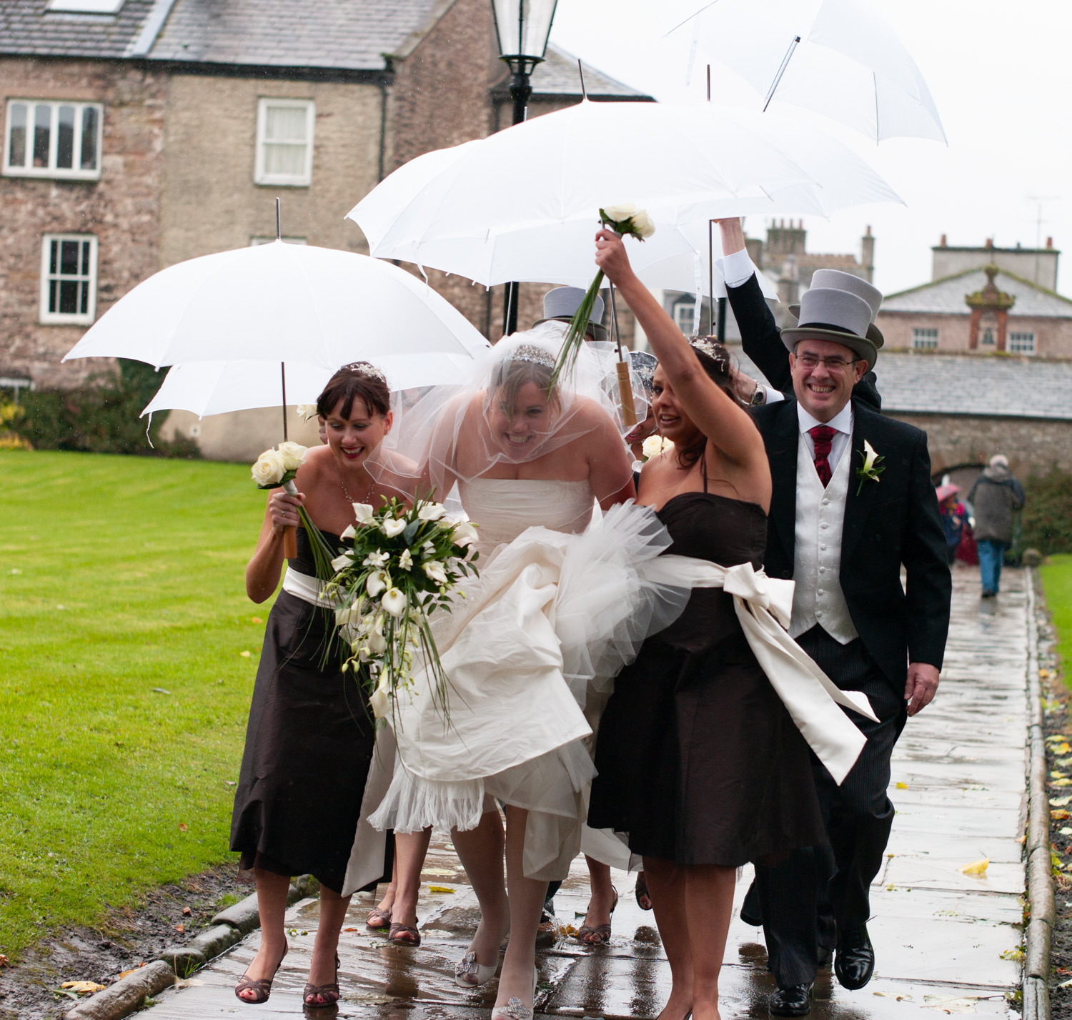 Umbrellas for the bride - Wedding Ceremony photography Leeds and Yorkshire