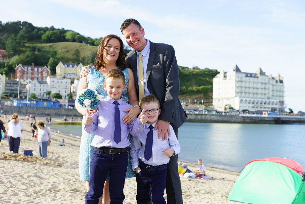 Family Group photo on the Beach by West Yorkshire wedding photographer