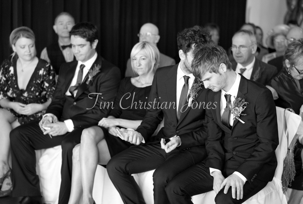 Best man chat's with the groom sat waiting for the ceremony to start