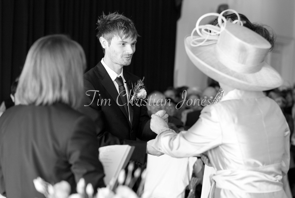 Groom is passed the bride's ring