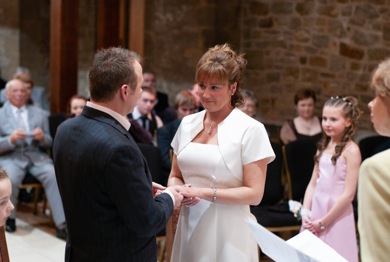 Guy placing the ring on Karen’s finger