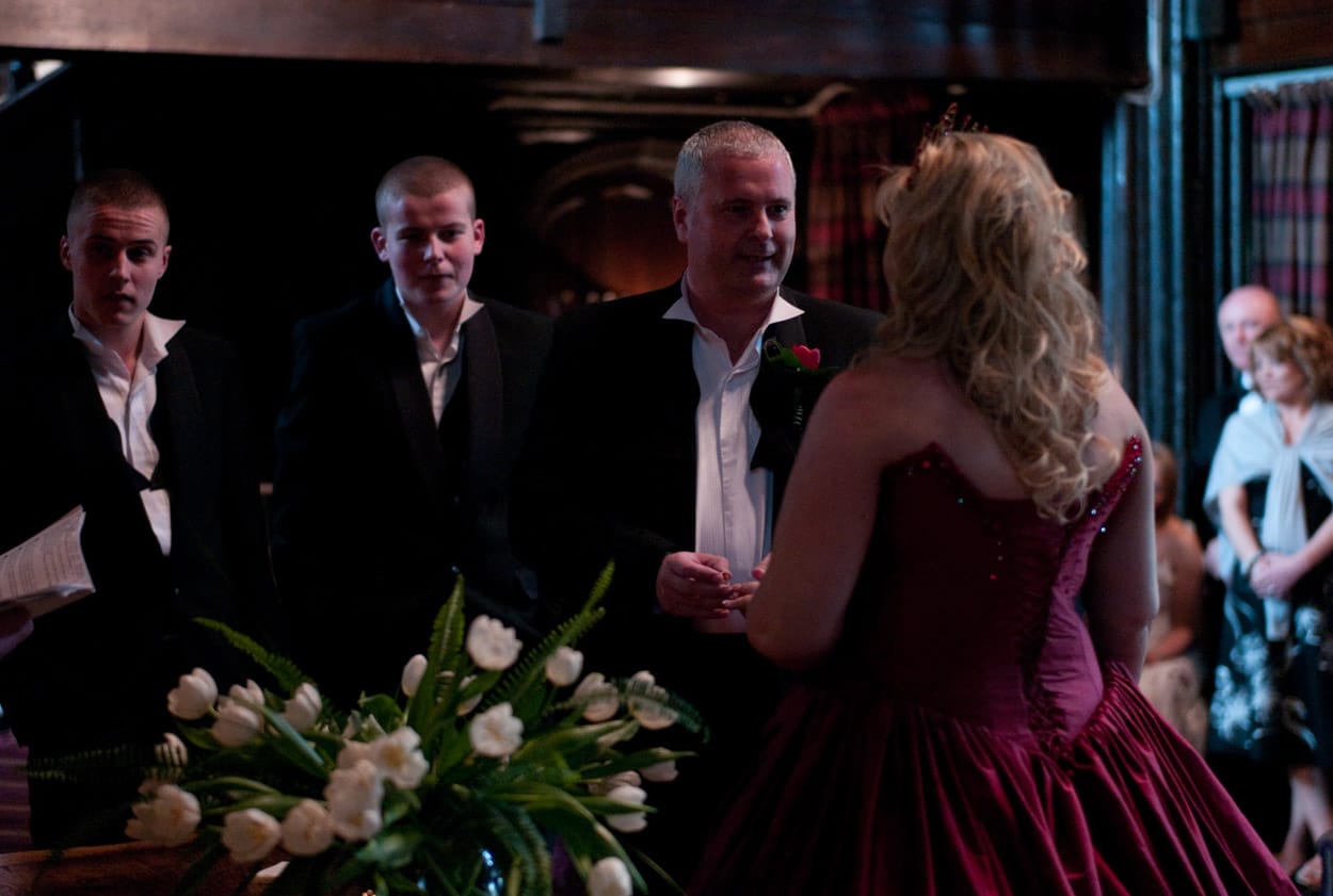 Mike places Nikki’s ring during the vows in the old ceremony room.