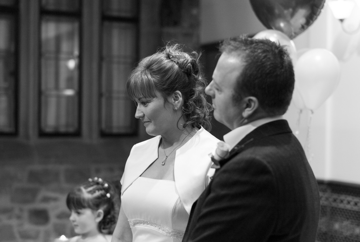 Mother watching proudly as her daughter reads
