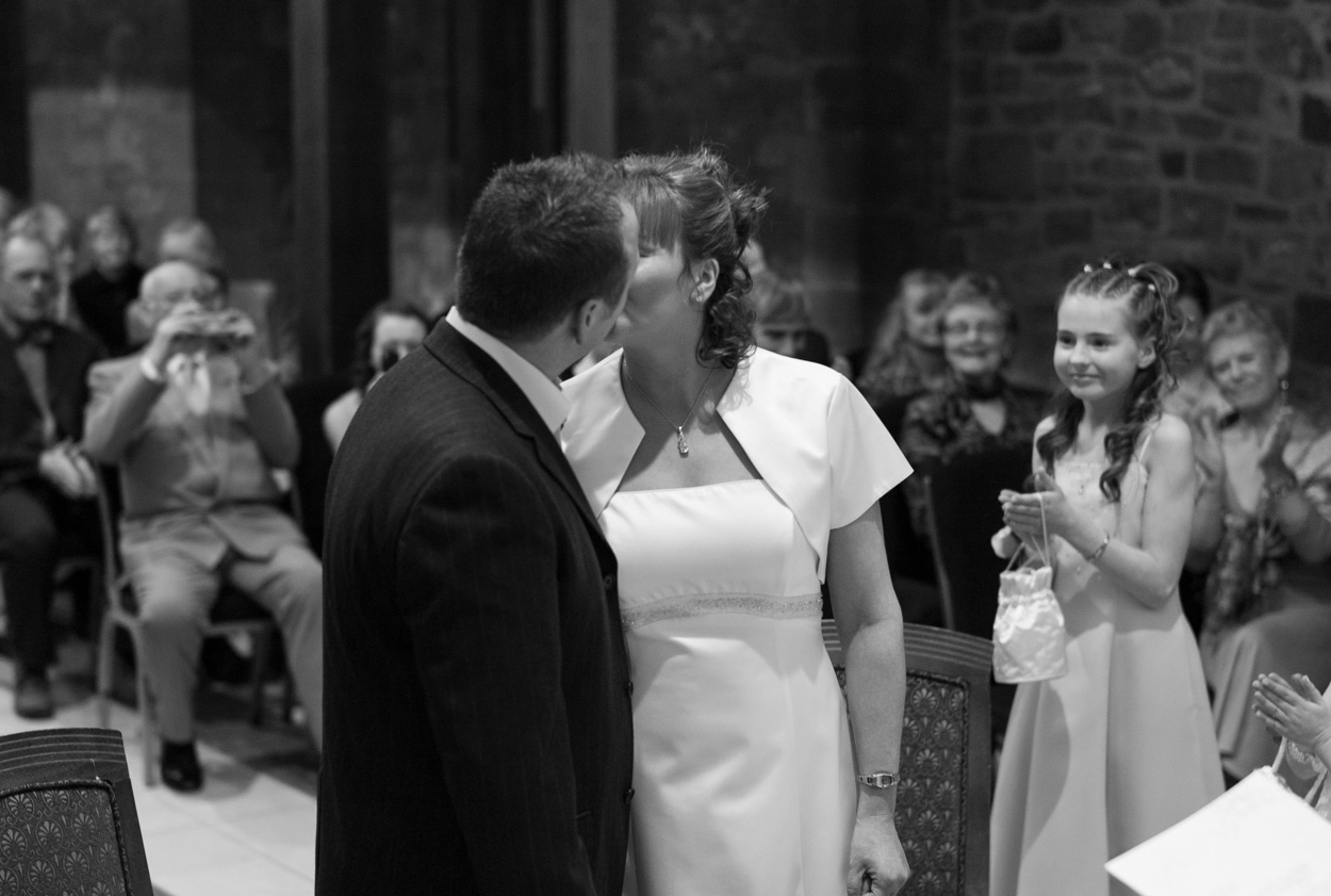 First kiss as guests and cameras capture the moment