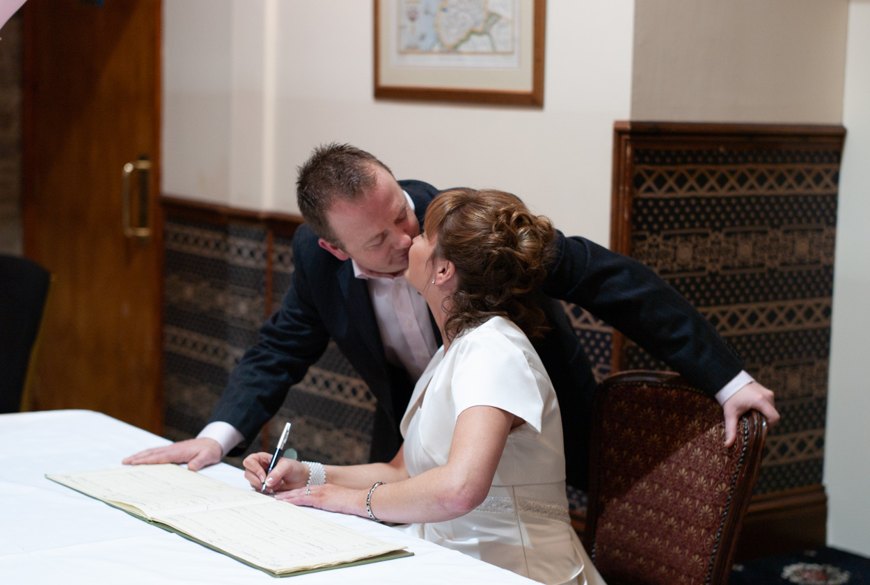 Signing the register and a kiss