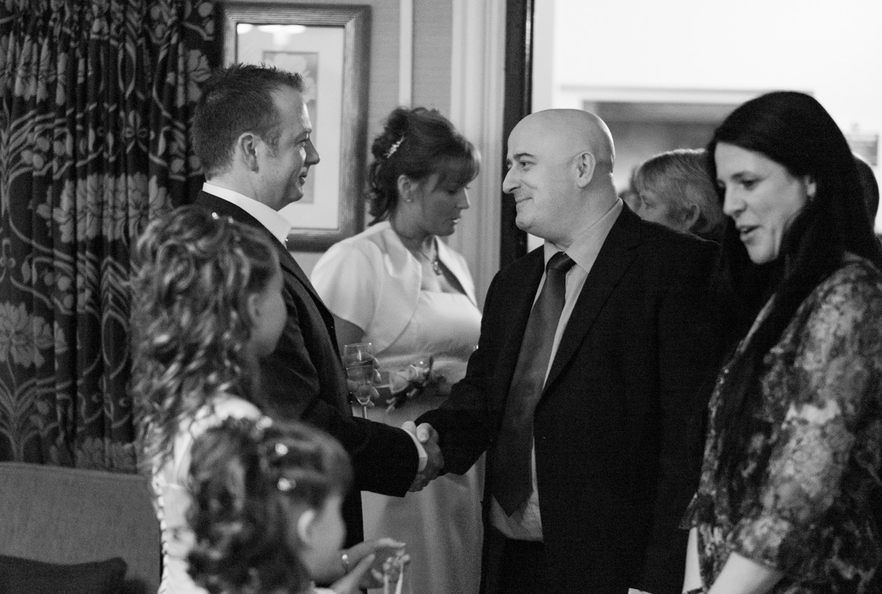 Couple greeting guests after the ceremony