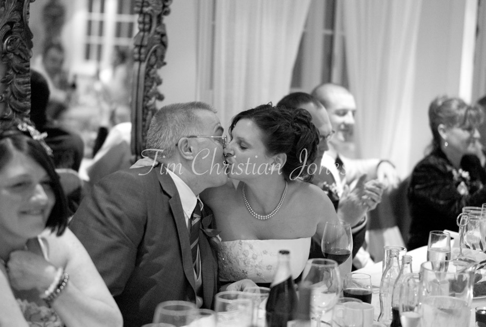 Julie leans in to kiss her dad, the speech over, emotions close to the surface.