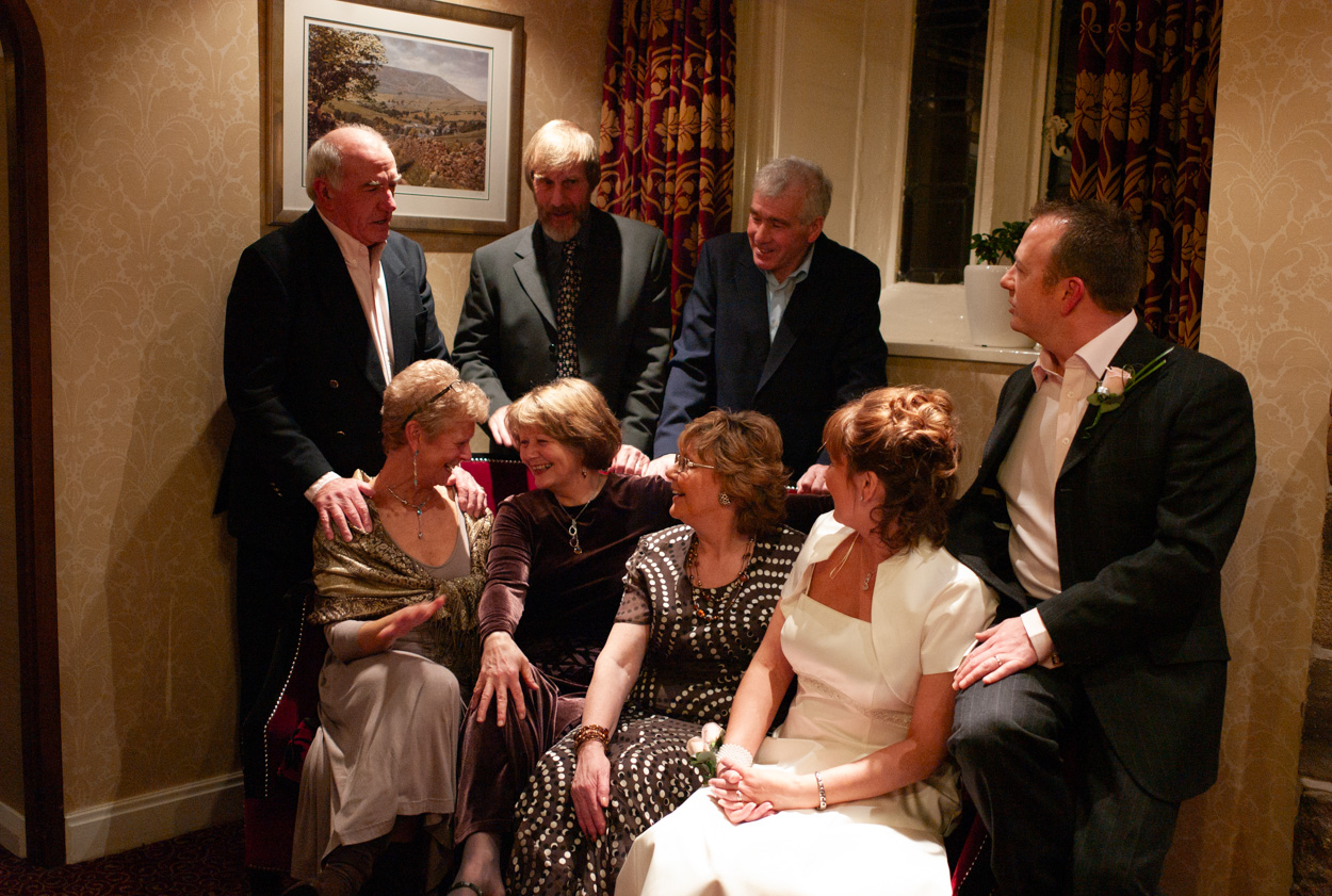 Casual group photo on sofa with family and friends