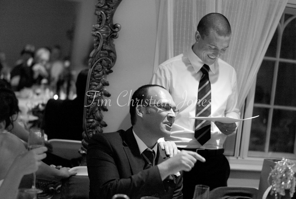 The best man’s speech sparks a big reaction from Pat, caught mid-laugh at the top table.